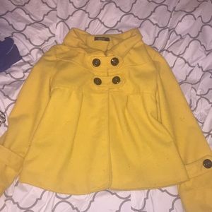 yellow peacoat with black buttons.
